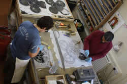 Laura and Antonio glazing tracery lights.